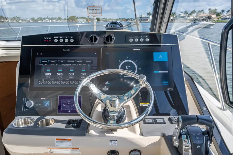 Slide: The Image of Helm of 2021 Boston Whaler 405 Conquest with advanced navigation displays. - 43