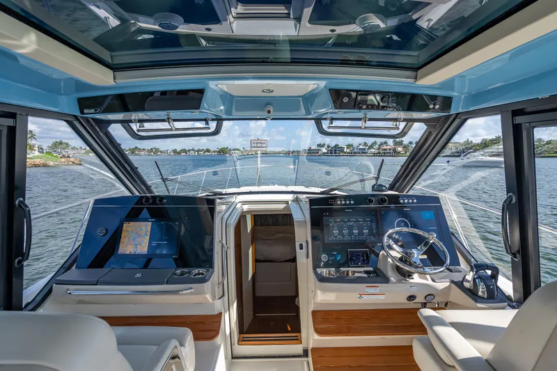 Slide: The Image of Interior view of 2021 Boston Whaler 405 Conquest boat cockpit with advanced navigation systems. - 45