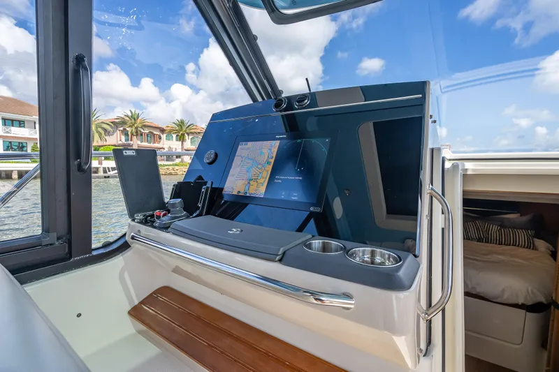 Slide: The Image of Interior view of 2021 Boston Whaler 405 Conquest boat cockpit with navigation display. - 48