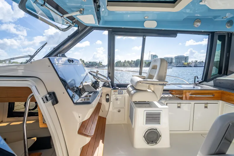 Slide: The Image of Interior view of 2021 Boston Whaler 405 Conquest boat cockpit with modern controls. - 49