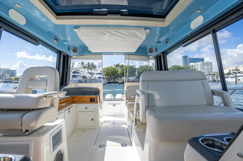 Slide: The Image of Interior of 2021 Boston Whaler 405 Conquest yacht, featuring luxurious seating and modern design. - 50
