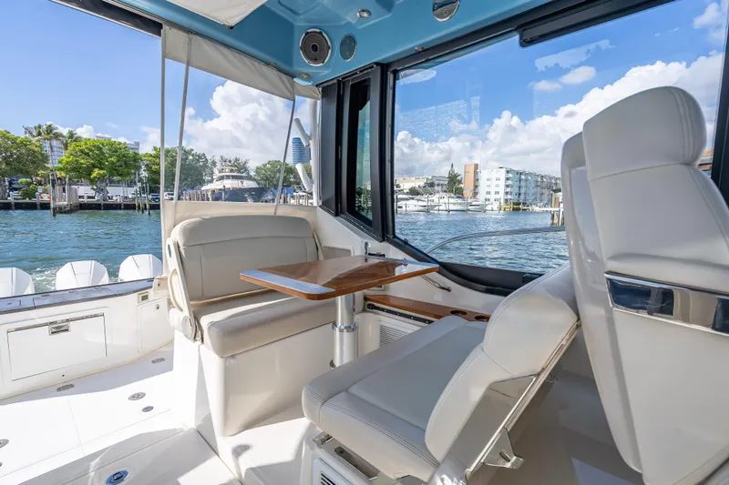Slide: The Image of Interior view of 2021 Boston Whaler 405 Conquest boat with seating and table. - 54