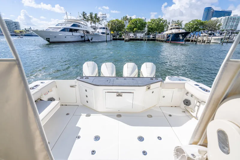 Slide: The Image of 2021 Boston Whaler 405 Conquest boat deck with scenic marina view. - 55