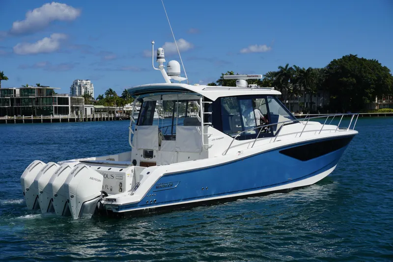 Slide: The Image of 2021 Boston Whaler 405 Conquest boat cruising on a sunny day. - 6