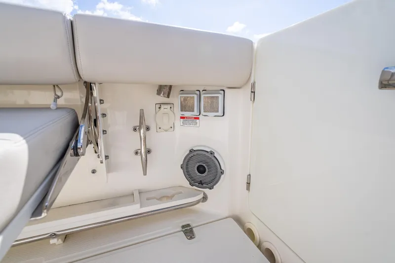 Slide: The Image of 2021 Boston Whaler 405 Conquest boat interior with seating and speaker detail. - 67