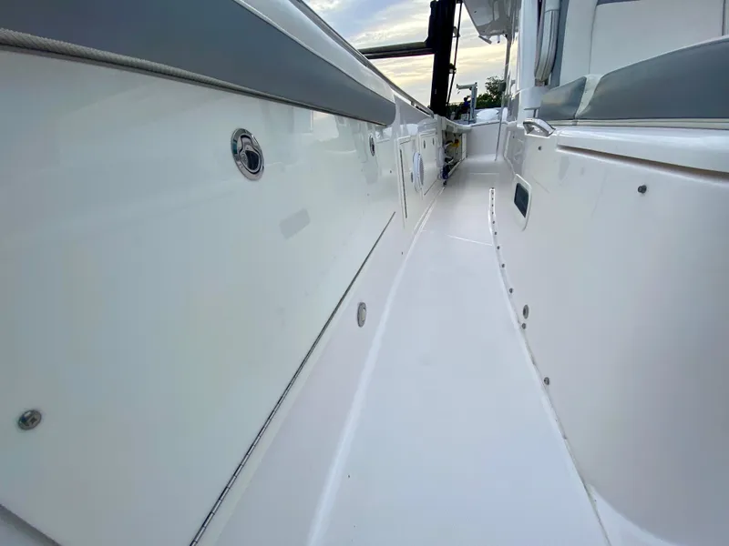 Slide: The Image of Side view of 2016 Everglades 435 Center Console boat deck, showcasing sleek design. - 14