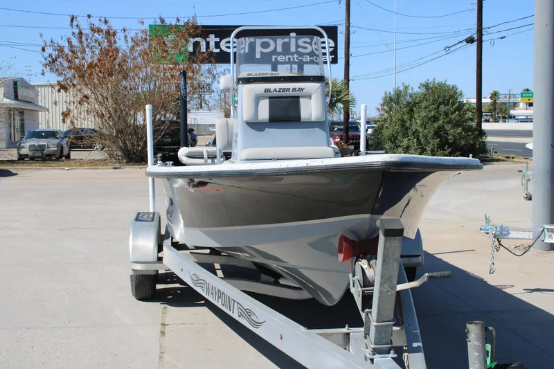 Slide: The Image of 2017 Blazer Bay 2170 boat on trailer in parking lot. - 13