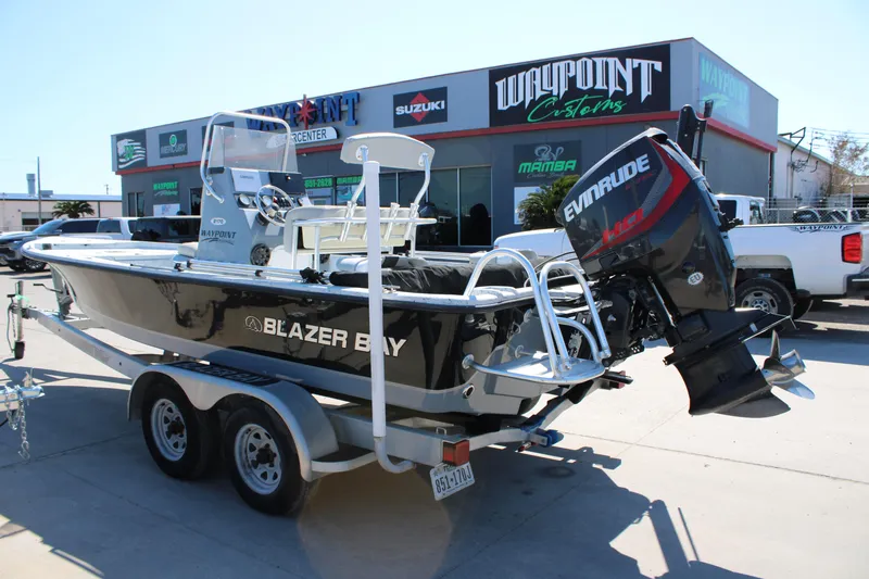 Slide: The Image of 2017 Blazer Bay 2170 boat with Evinrude motor on trailer at dealership. - 3