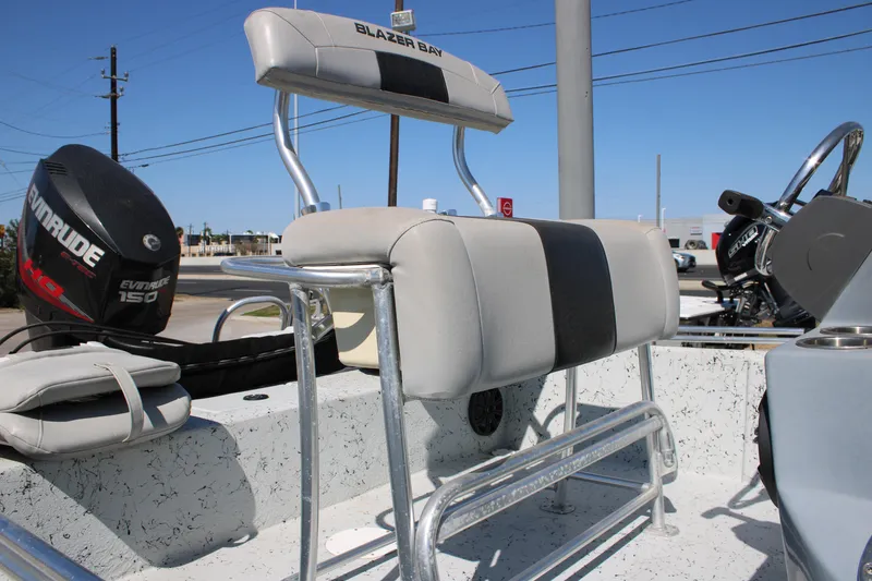 Slide: The Image of 2017 Blazer Bay 2170 boat interior with Evinrude 150 engine and seating. - 9