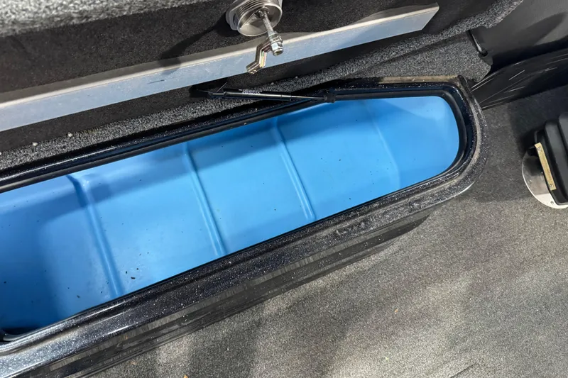 Slide: The Image of Storage compartment in 2020 Nitro ZV21 boat with blue interior. - 12