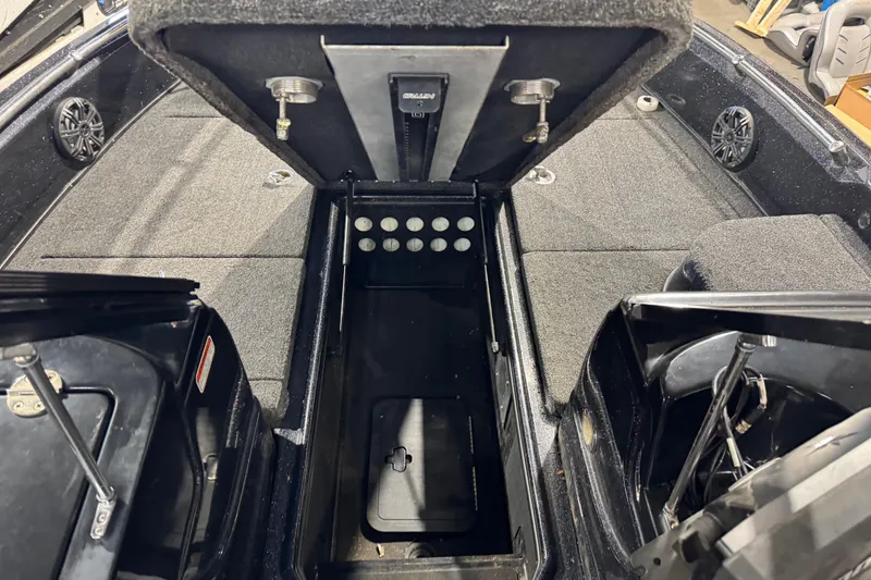 Slide: The Image of 2020 Nitro ZV21 boat interior with open storage compartments and carpeted flooring. - 14