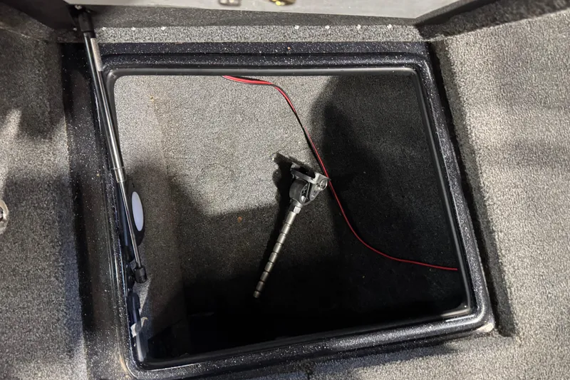 Slide: The Image of Open storage compartment in 2020 Nitro ZV21 boat with hydraulic lift and wiring. - 18