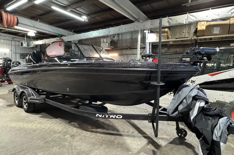 Slide: The Image of 2020 Nitro ZV21 boat on trailer in indoor storage facility. - 2