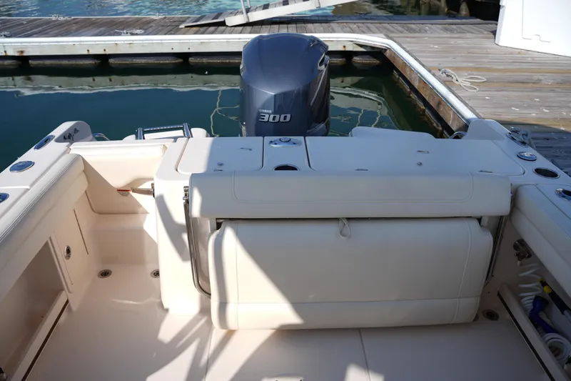 Slide: The Image of 2020 Grady-White Freedom 235 boat interior with Yamaha 300 engine at dock. - 15