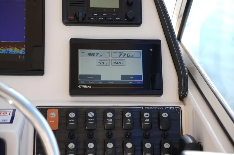 Slide: The Image of Control panel of 2020 Grady-White Freedom 235 boat with Yamaha display. - 25