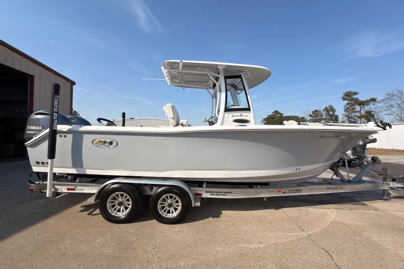 The Image of 2023 Sea Hunt Gamefish 25 boat on trailer, side view, outdoors. - 1