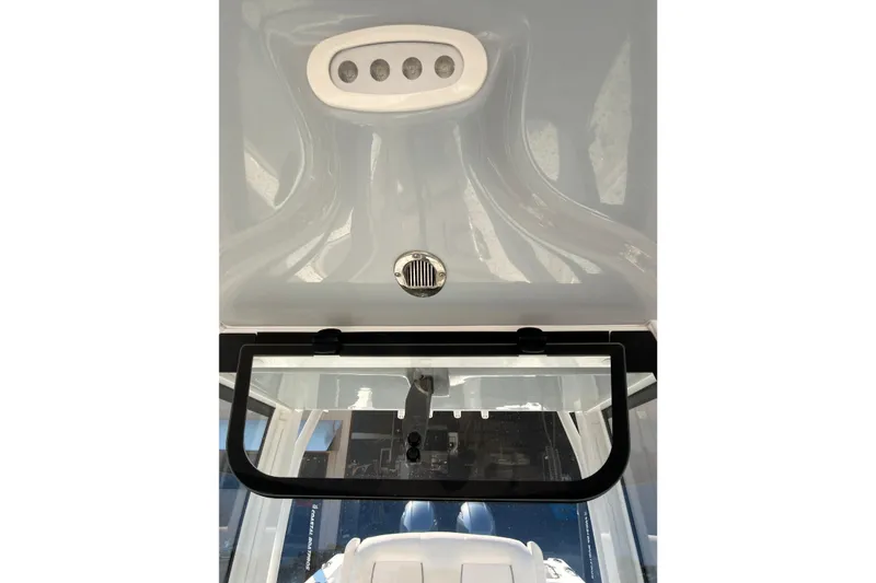 Slide: The Image of 2023 Sea Hunt Gamefish 25 boat interior with dual engines and seating. - 20