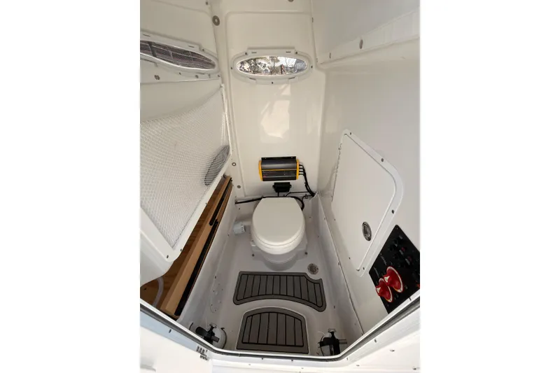 Slide: The Image of 2023 Sea Hunt Gamefish 25 boat interior with white seating and deck. - 23