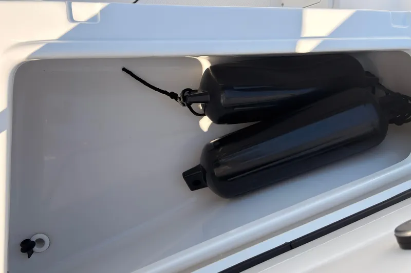 Slide: The Image of 2023 Sea Hunt Gamefish 25 boat interior with overhead lighting and window. - 27