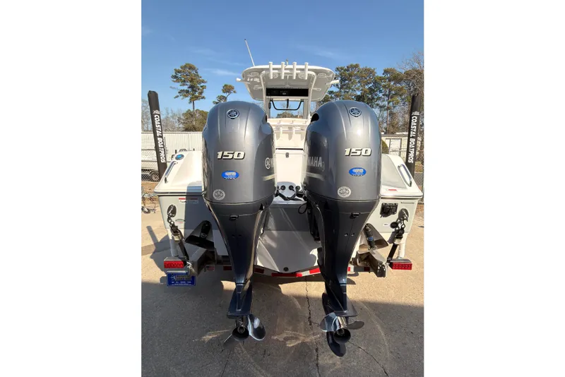 Slide: The Image of 2023 Sea Hunt Gamefish 25 boat interior with cushioned seating and storage compartments. - 4