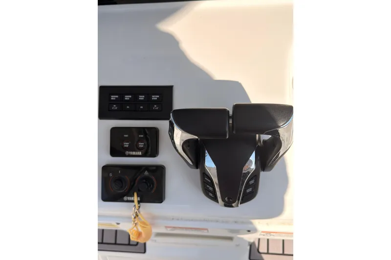 Slide: The Image of 2023 Sea Hunt Gamefish 25 helm with Garmin displays and modern controls. - 7