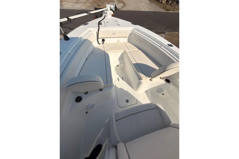 Slide: The Image of 2023 Sea Hunt Gamefish 25 dashboard with Garmin displays and steering wheel. - 8