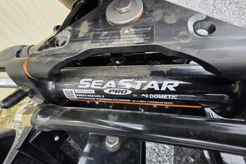 Slide: The Image of Close-up of SeaStar Pro outboard steering cylinder by Dometic on Nitro Z20 XL Pro 2026. - 10