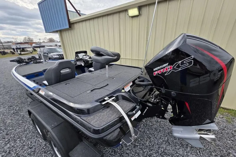 Slide: The Image of 2026 Nitro Z20 XL Pro boat with Mercury Pro XS 250 engine, parked outdoors. - 12
