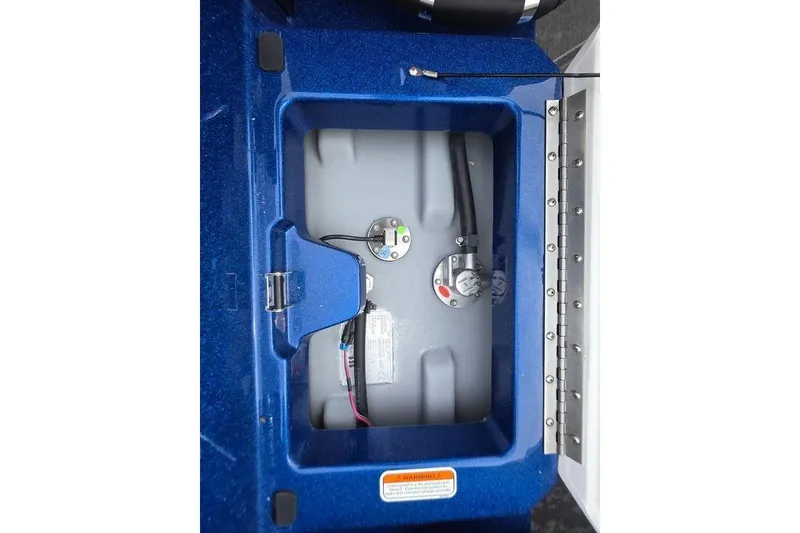 Slide: The Image of 2026 Nitro Z20 XL Pro boat fuel compartment with blue casing and visible gauges. - 35