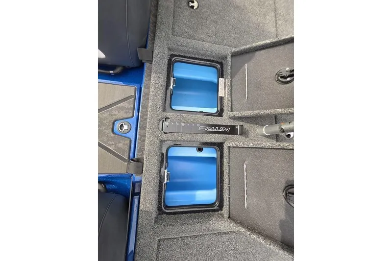Slide: The Image of 2026 Nitro Z20 XL Pro boat interior with storage compartments and blue accents. - 38
