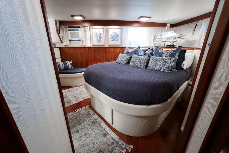 Slide: The Image of Luxurious bedroom interior of a 1975 Hatteras 58 Long Range Cruiser yacht. - 13