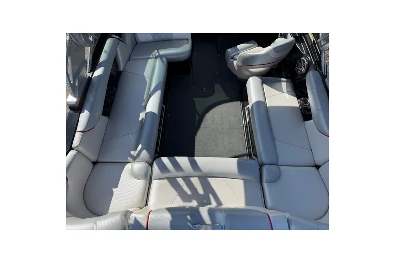 Slide: The Image of 2014 MasterCraft X30 boat interior with spacious seating and modern design. - 15