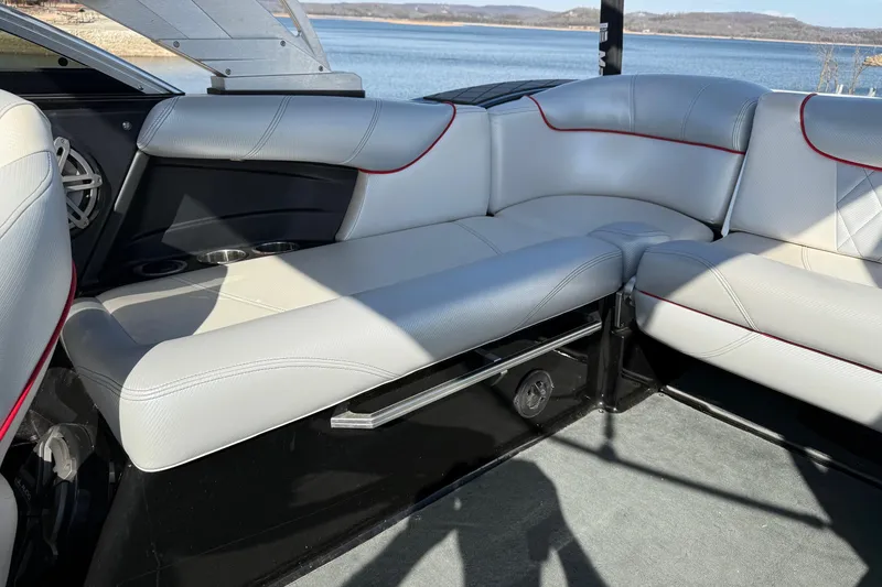 Slide: The Image of 2014 MasterCraft X30 boat interior with white leather seating and lake view. - 17