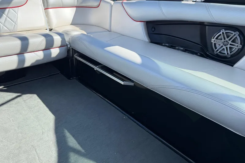 Slide: The Image of 2014 MasterCraft X30 interior with white seating and speaker detail. - 18