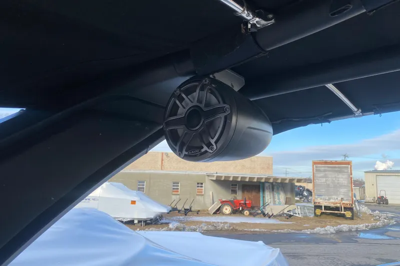 Slide: The Image of Speaker mounted on a 2021 Chaparral 26 Surf boat, outdoor setting. - 10