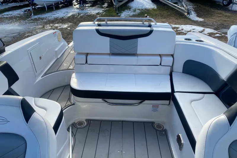 Slide: The Image of 2021 Chaparral 26 Surf boat interior with white and gray seating. - 5