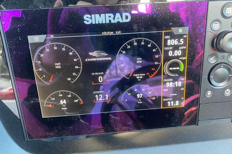 Slide: The Image of Dashboard of 2021 Chaparral 26 Surf boat with Simrad display showing engine metrics. - 6