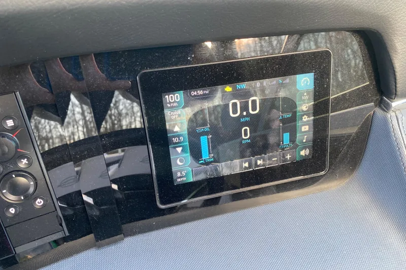 Slide: The Image of Dashboard display of a 2021 Chaparral 26 Surf boat showing speed and fuel information. - 7