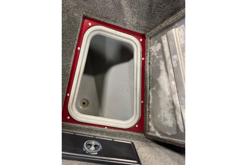 Slide: The Image of Open storage compartment in 2018 Tracker Pro Guide V-175 Combo boat. - 13