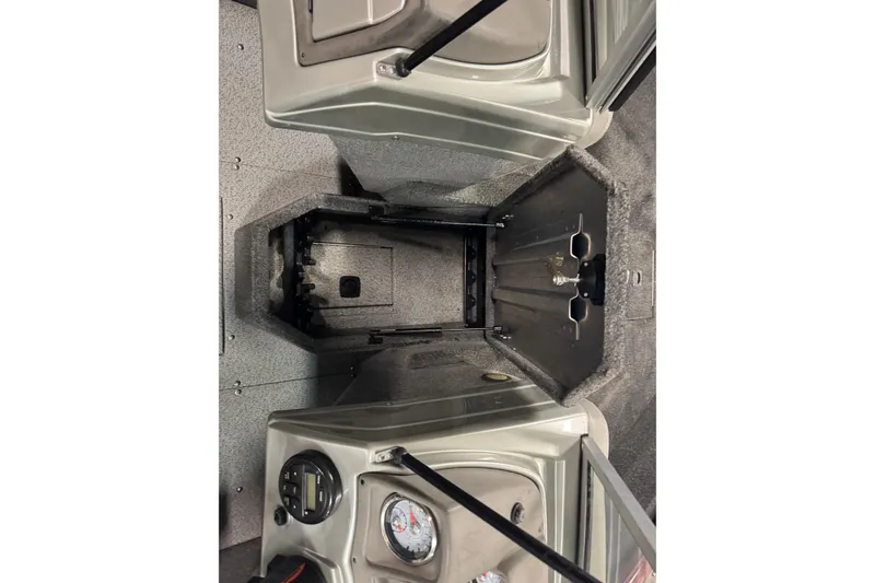 Slide: The Image of 2018 Tracker Pro Guide V-175 Combo boat interior with storage compartments and gauges. - 15