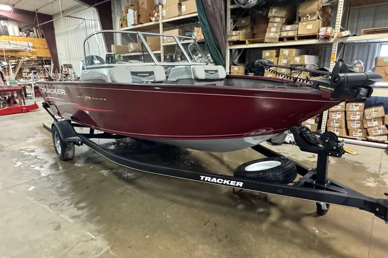 Slide: The Image of 2018 Tracker Pro Guide V-175 Combo boat in warehouse, on trailer. - 2