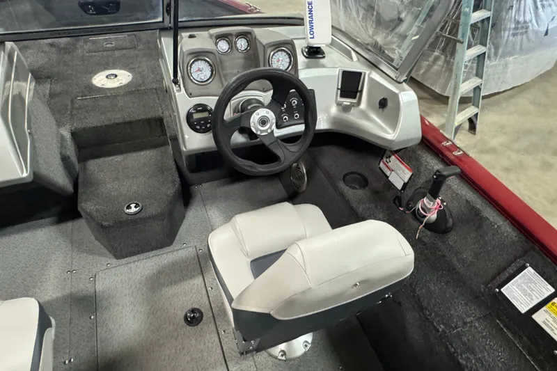 Slide: The Image of 2018 Tracker Pro Guide V-175 Combo boat interior with steering wheel and dashboard controls. - 7