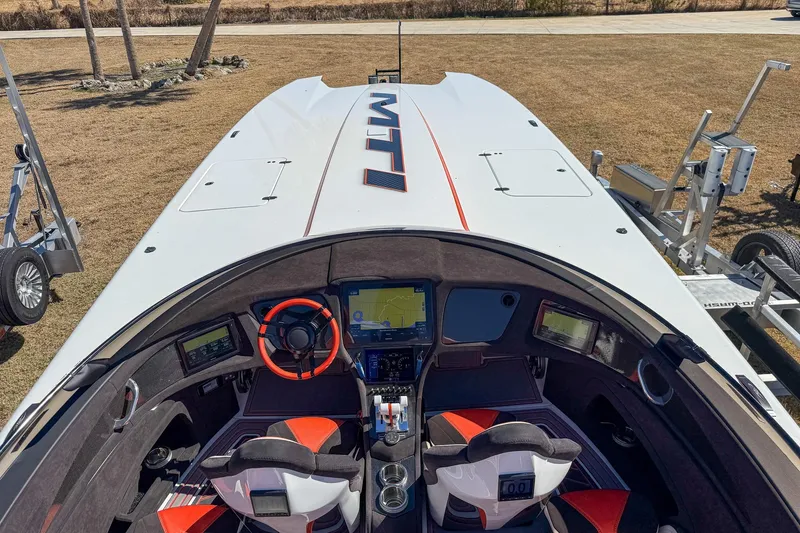 Slide: The Image of Cockpit view of 2021 MTI 390X boat with advanced navigation system and sporty design. - 15