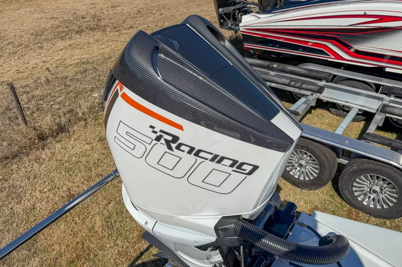 Slide: The Image of High-performance MTI 390X Racing 500 outboard motor, 2021 model, on a trailer. - 19