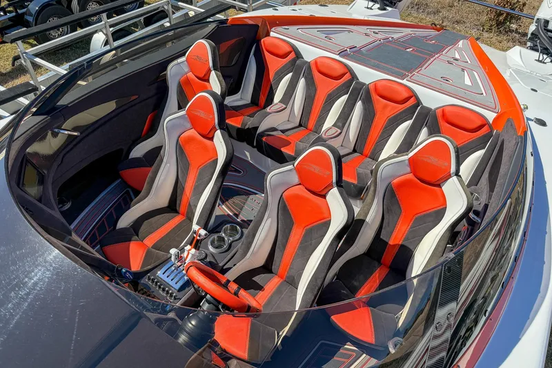 Slide: The Image of Interior of 2021 MTI 390X boat with red and black seating arrangement. - 4