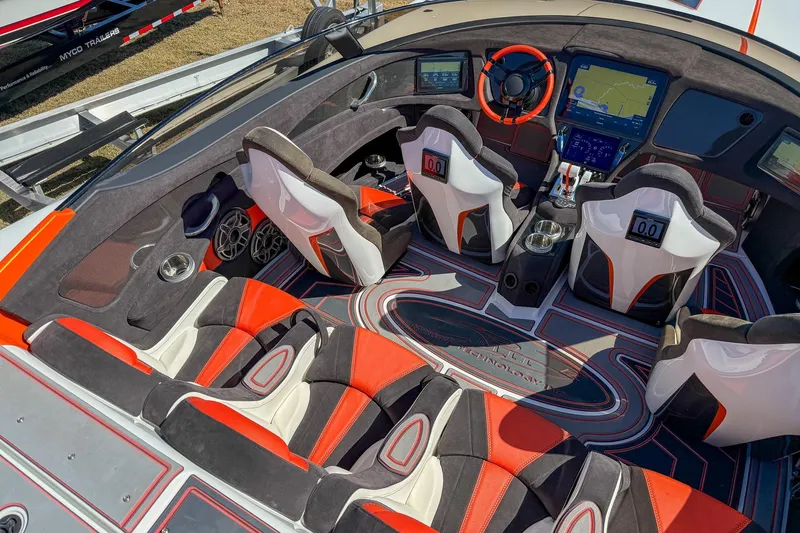 Slide: The Image of Interior of a 2021 MTI 390X boat with modern seating and advanced navigation system. - 7