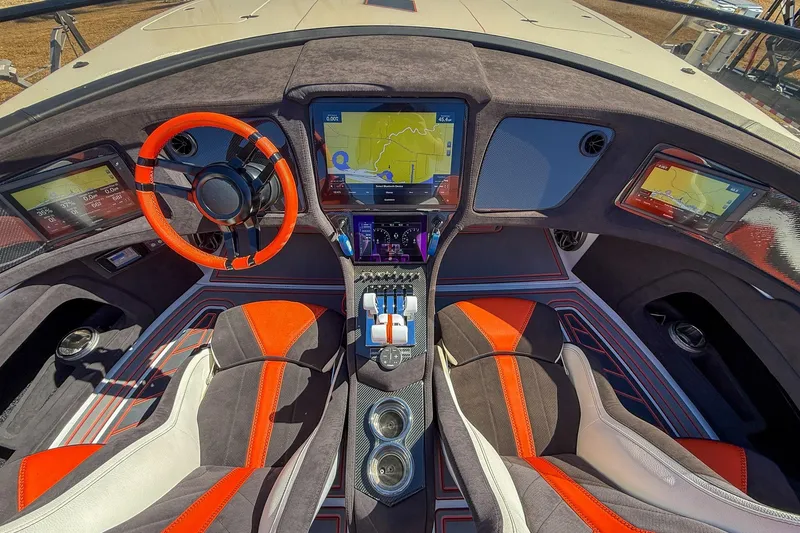 Slide: The Image of Luxurious MTI 390X 2021 boat cockpit with advanced navigation screens and sporty red accents. - 9