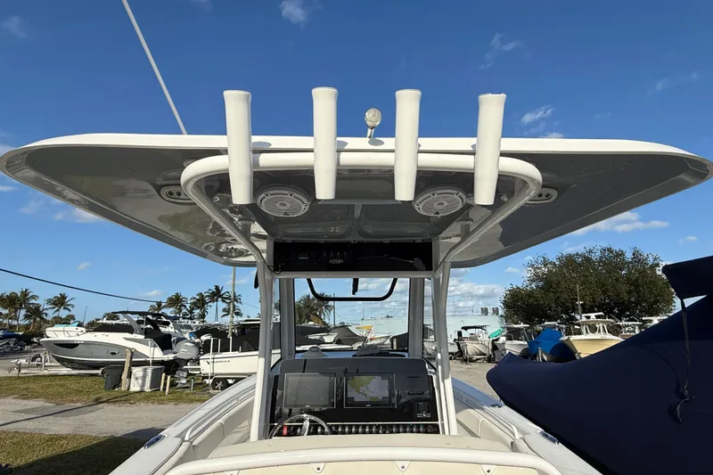 Slide: The Image of 2021 Sea Hunt Ultra 305 SE boat with T-top and navigation equipment. - 12
