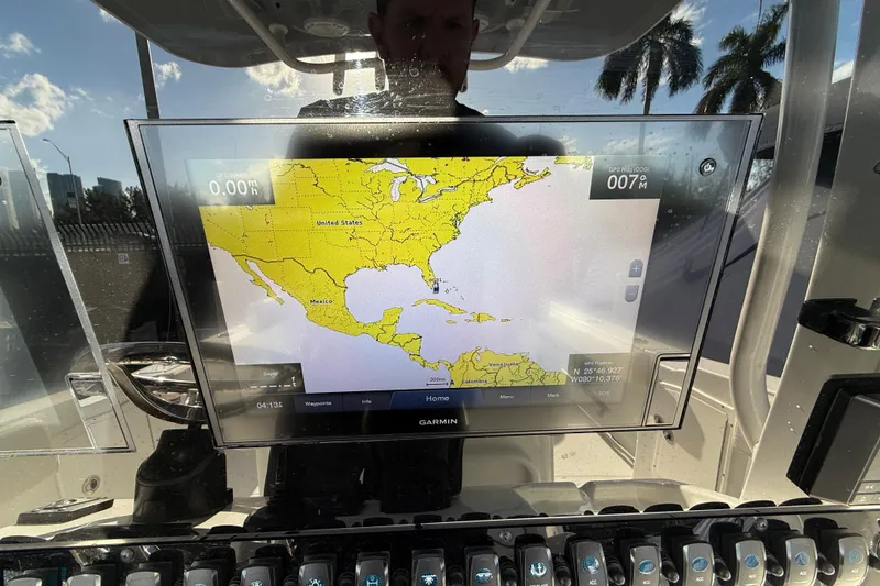 Slide: The Image of Garmin GPS display on 2021 Sea Hunt Ultra 305 SE boat, showing North America map. - 17
