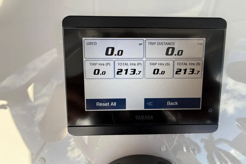 Slide: The Image of Yamaha display on 2021 Sea Hunt Ultra 305 SE showing trip and total hours. - 19